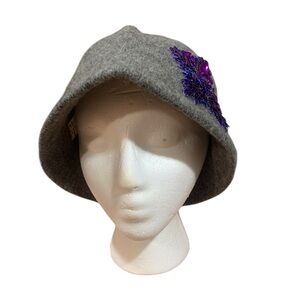 Y2K Urban Outfitter’s wool hat with purple sequined flower